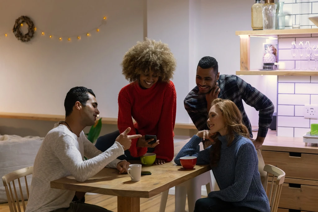 tenants socialising in the common spaces of a co-living home