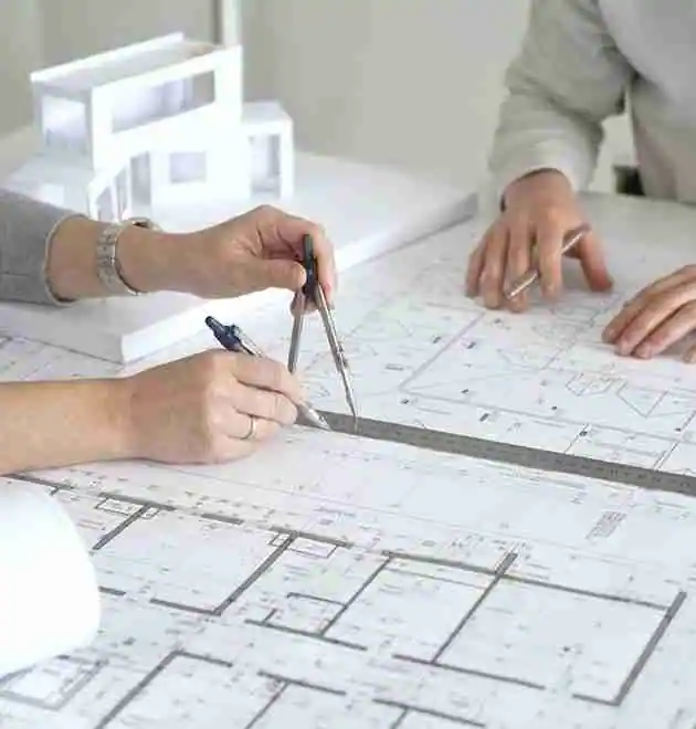 An investor works with an architect to design a plan for a co-living conversion