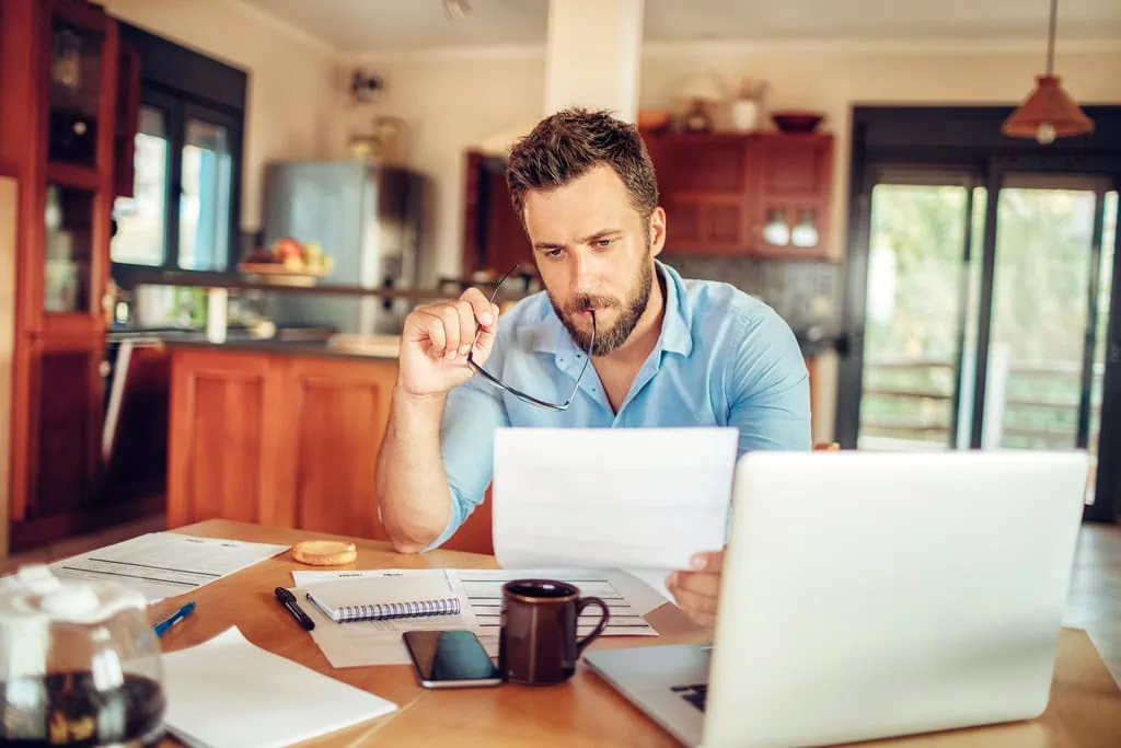 man assessing property, building and construction risk for his property investment